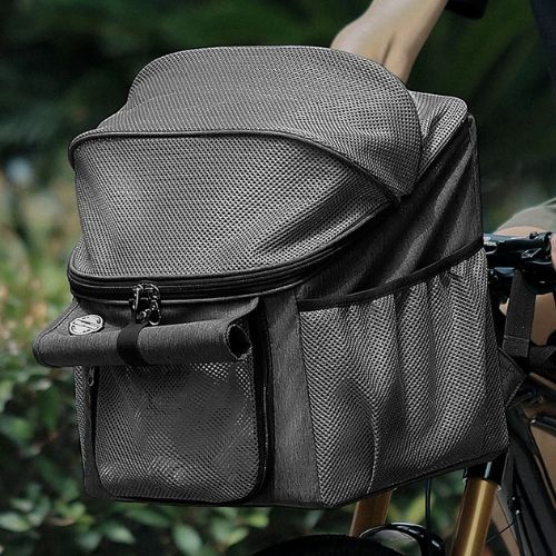 Gros plan du panier velo chien en textile gris avec filet de protection et poches latérales.